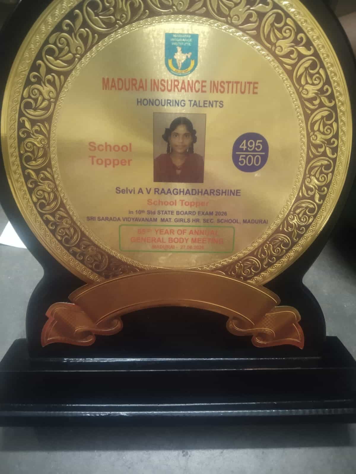LIC  of Madurai  honored her  with Memento and prize